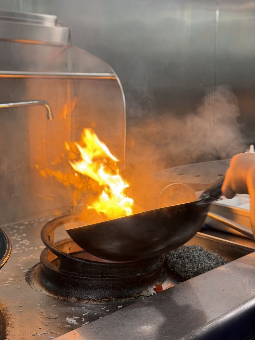 Live wok cooking in the Mahek kitchen